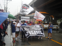 Basta Run Against Torture V participants, led by civil society organizations prepare to brave the rain and run to campaign for a torture free Philippines.