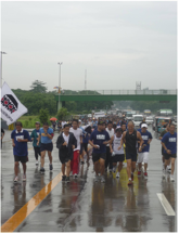 Runners of the Basta Run Against Torture V together with Fr. Robert Reyes, jogged along Commonwealth avenue.